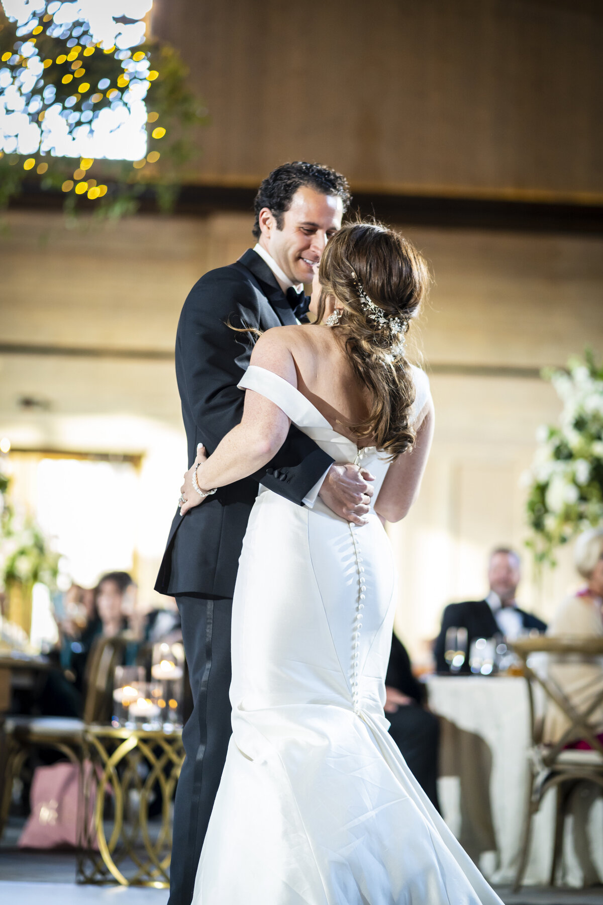 Bride and groom dancing.