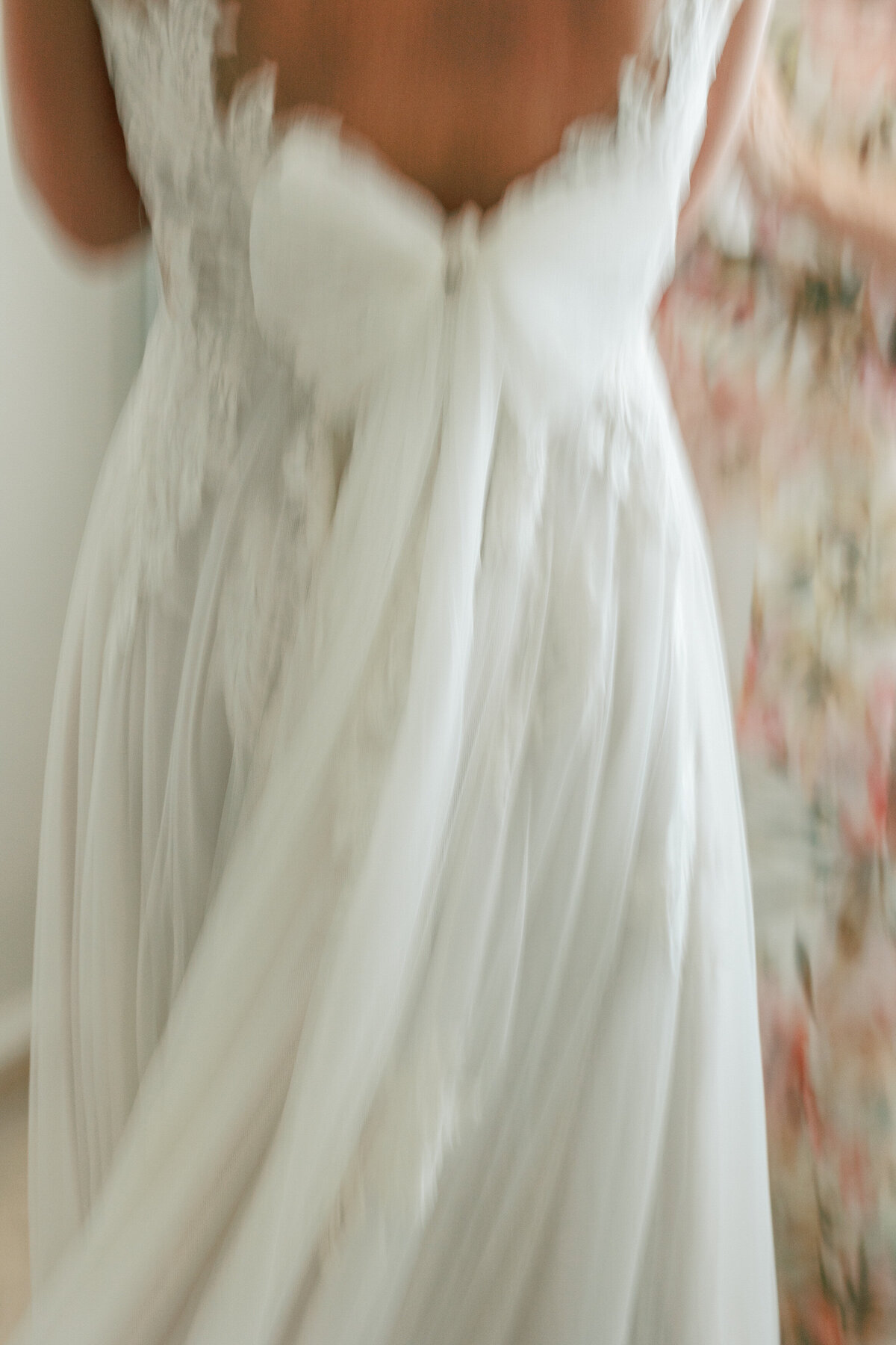 Back of lace wedding gown with a soft tulle bow, captured during Cancun wedding by Philadelphia photographer Olivia Casey.