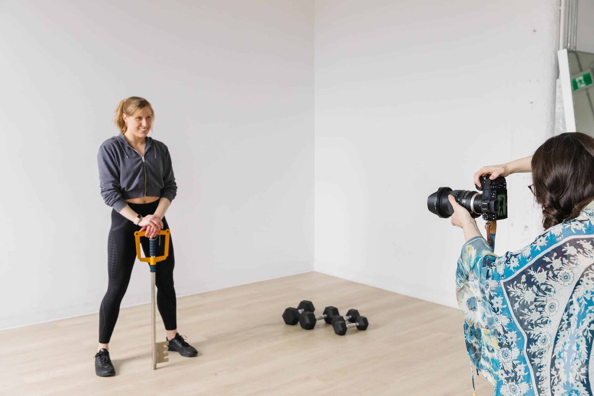 Personal trainer client being photographed