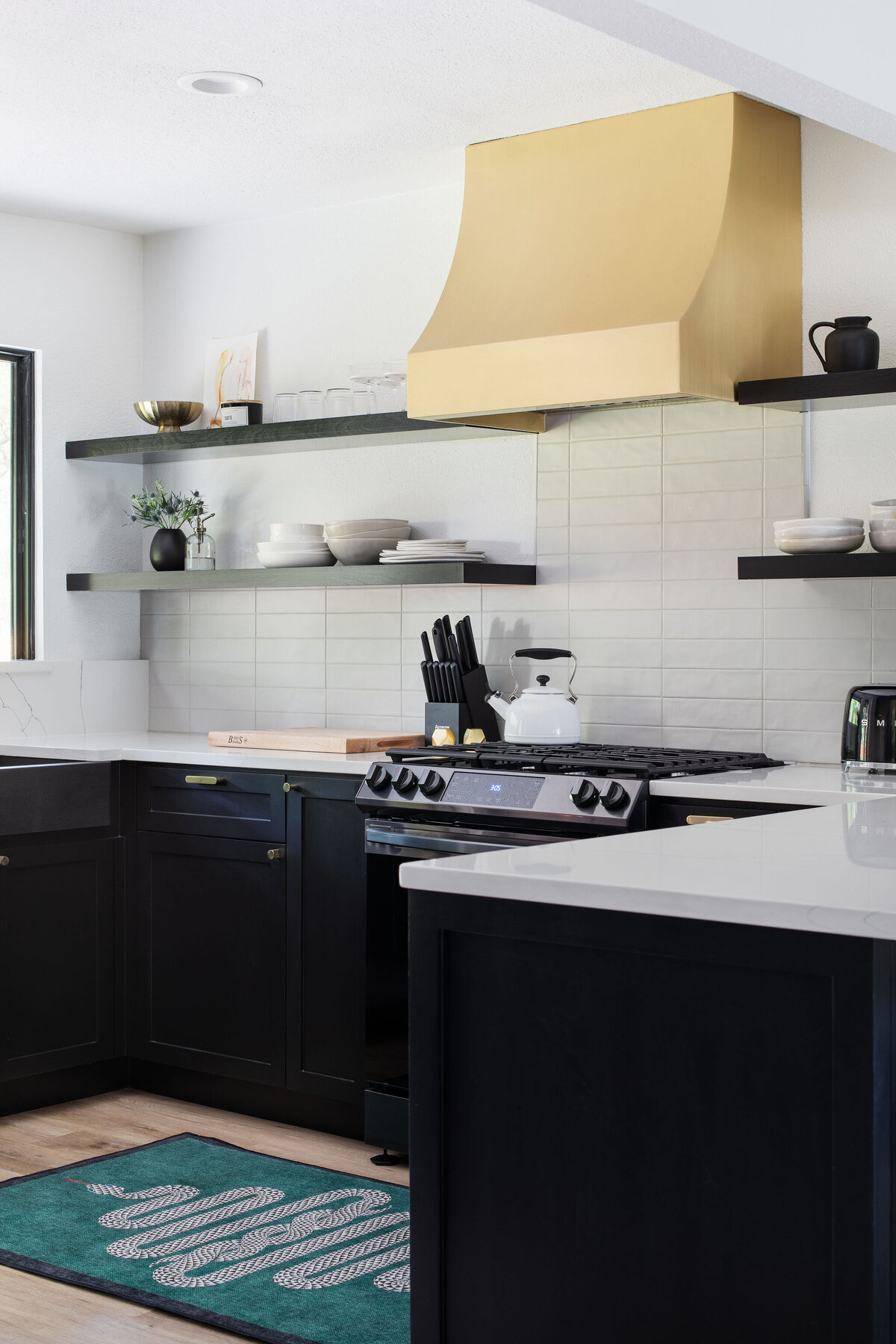 modern chic posh kitchen black and brass remodel rental design 3