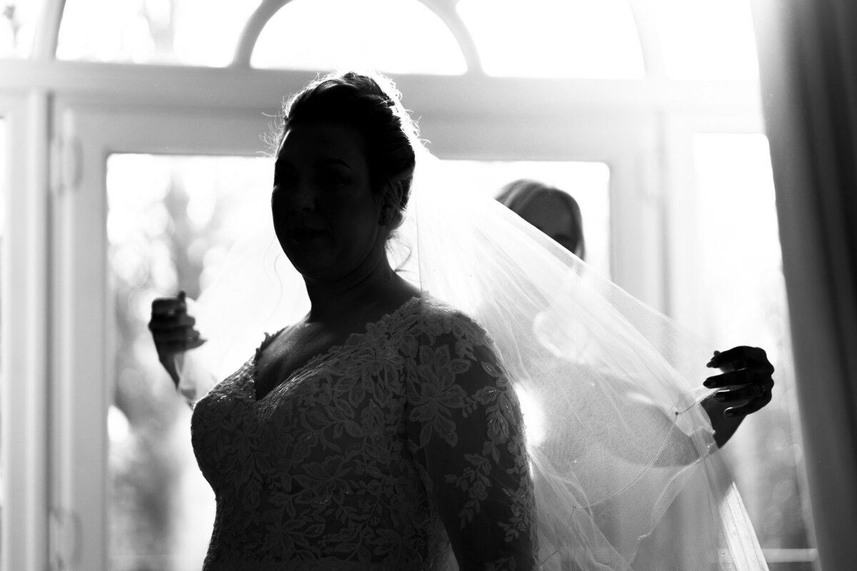 Silhoutte of Bride having her veil put in at Ashfield house taken by Anthony Horseman