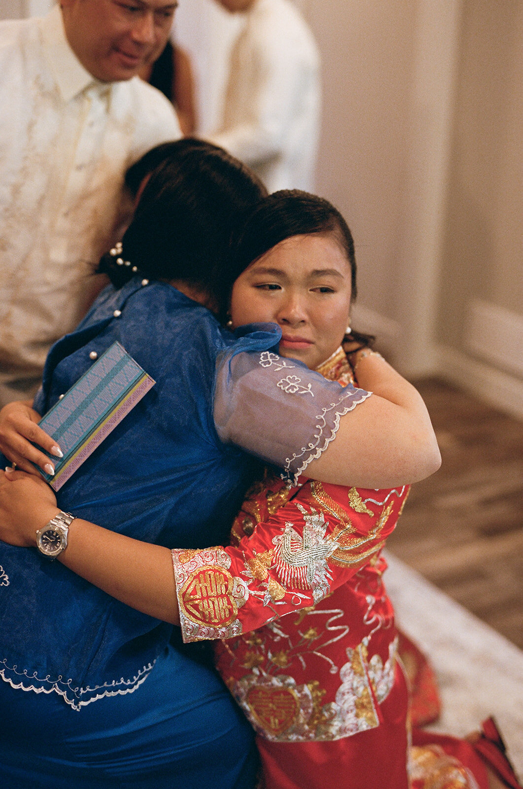 bride crying during tea ceremony on the day before wedding