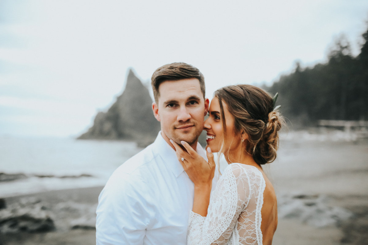 Bride and Groom embrace during their vows on the elopement in the Oregon Coast.
