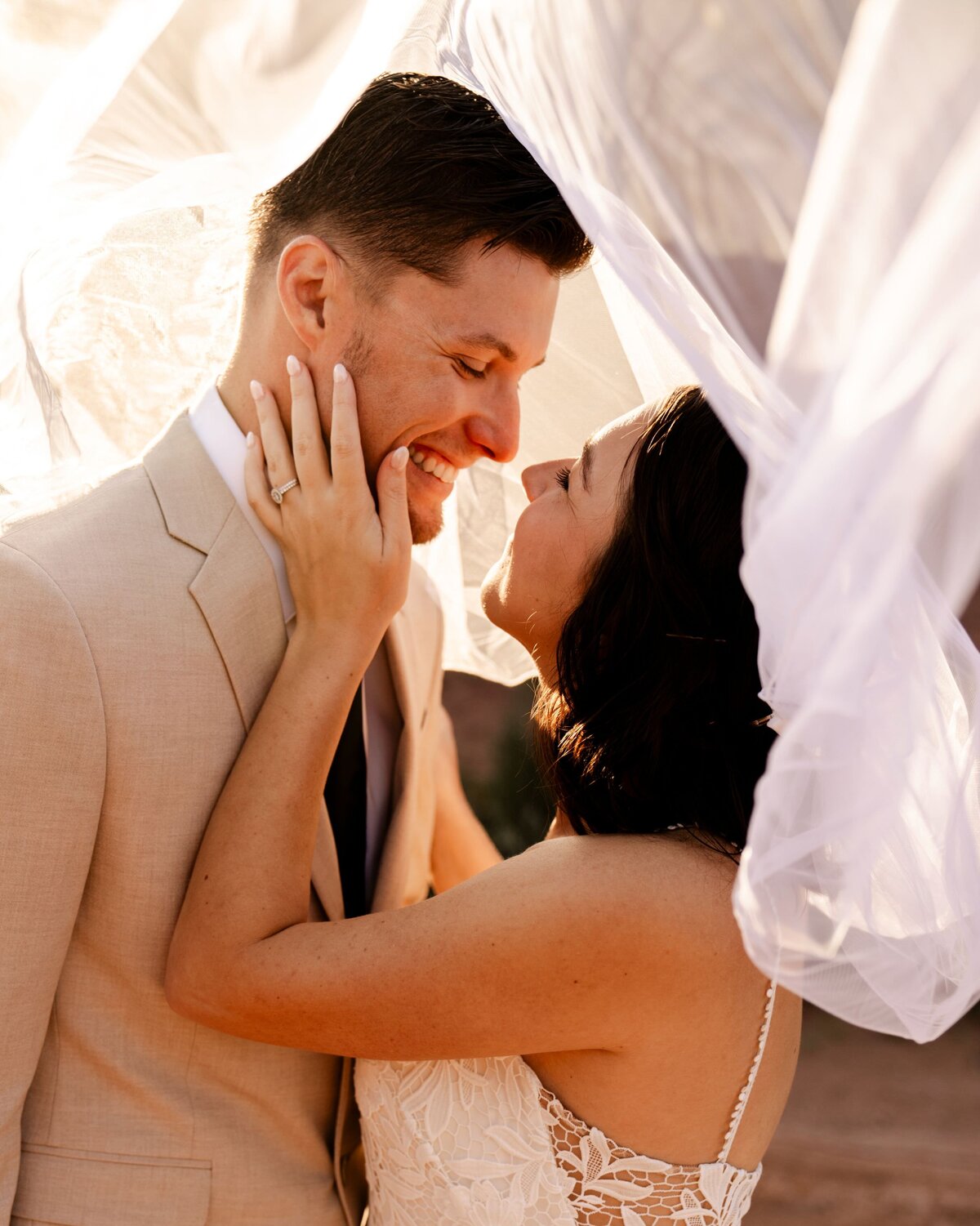denver colorado wedding photographer - bride and groom smiling at each other