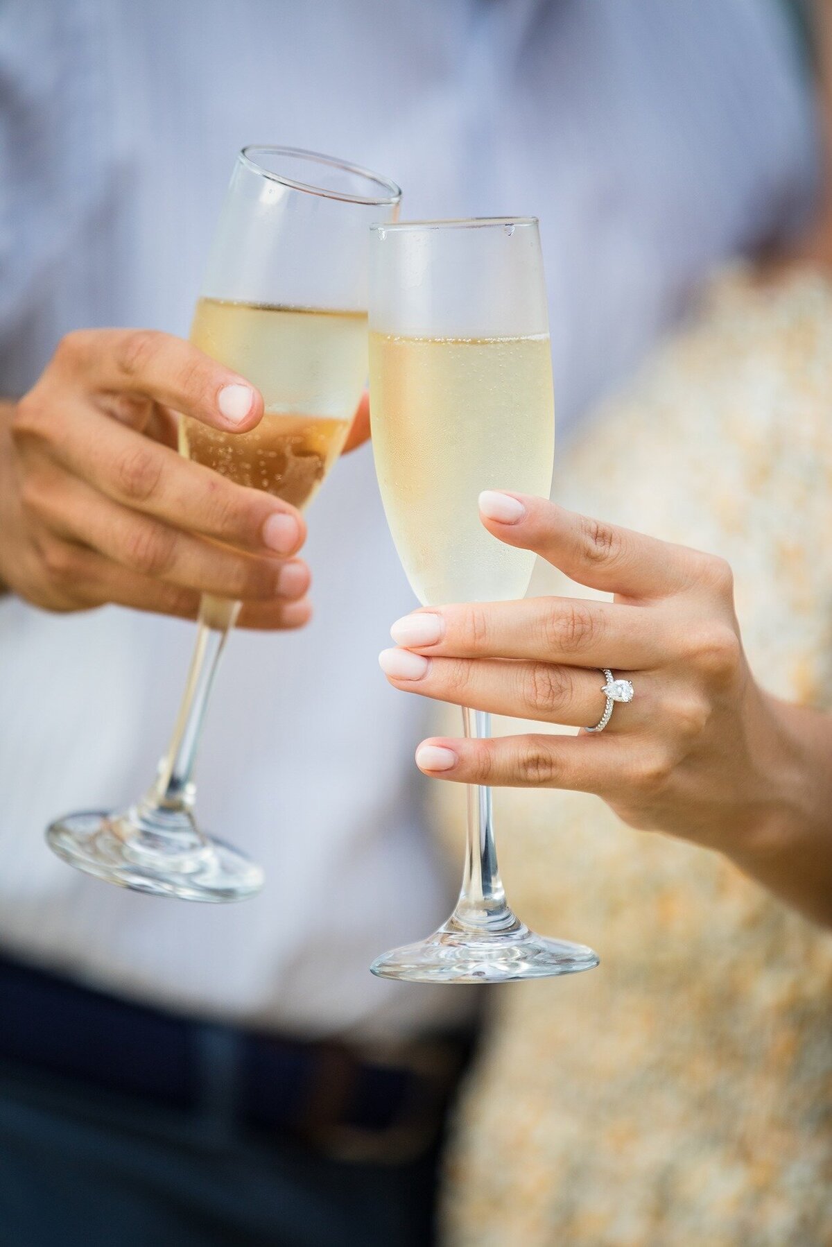 champagne-cheers-with-engagement-ring