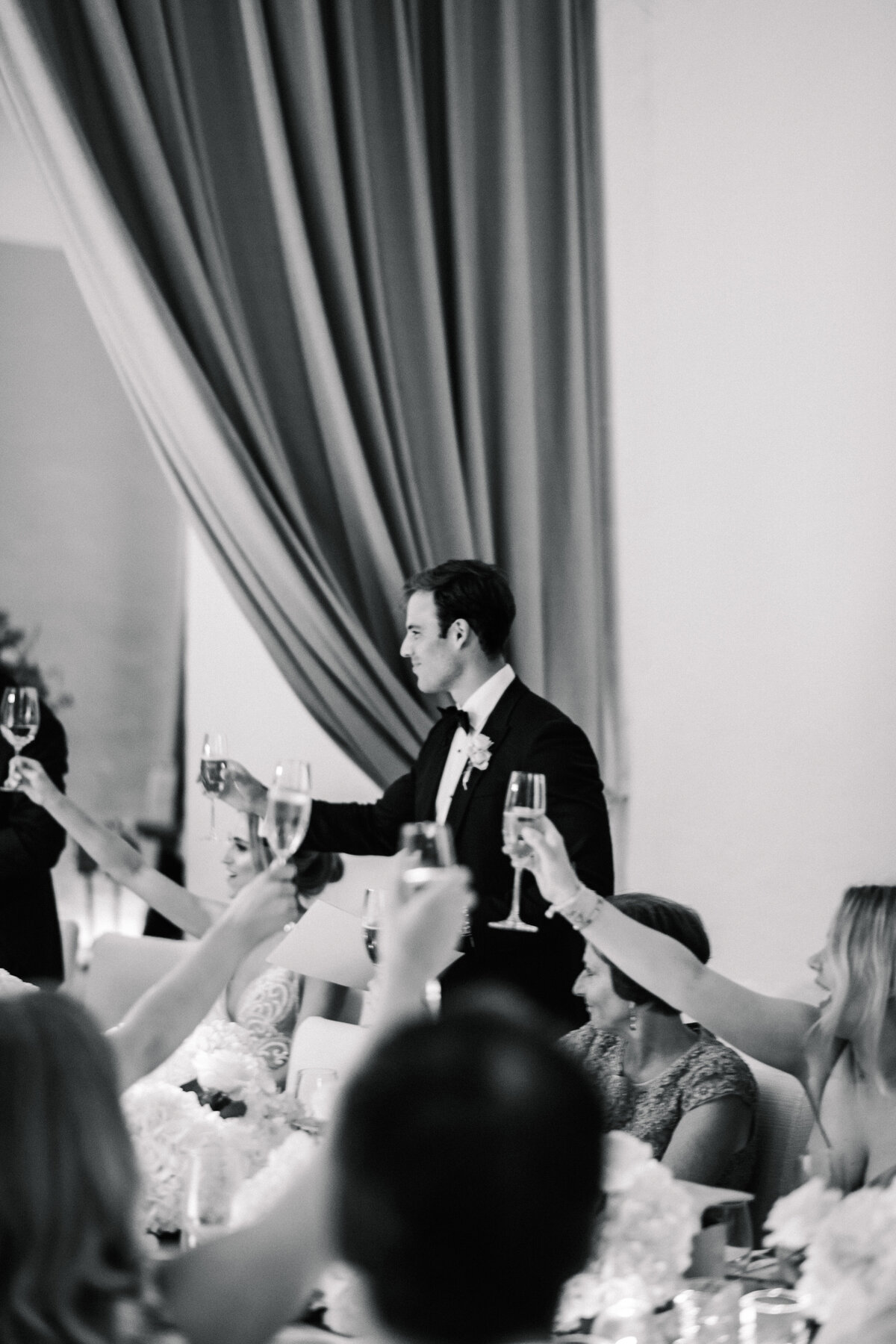 toasting the groom at wedding reception cap rocat