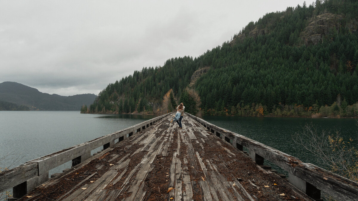 Couple on a trestle bridge in Campbell River during their engagement session by latitude 49 photography