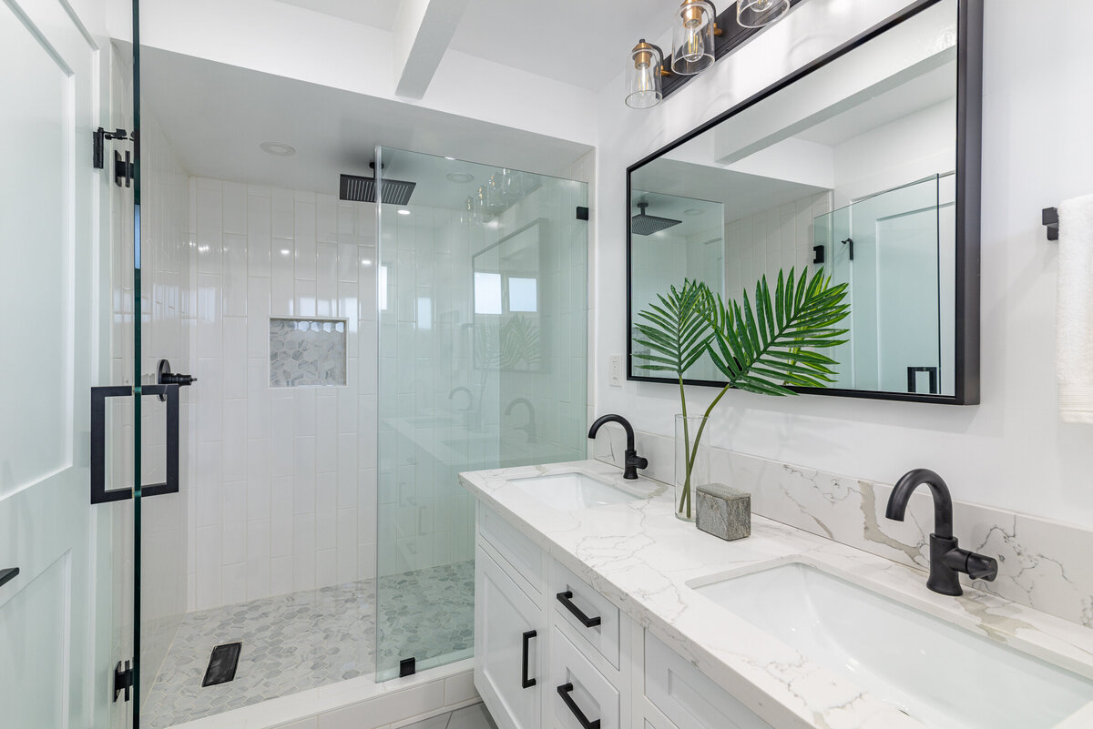 white-bathroom-double-vanity-black-tile-shower