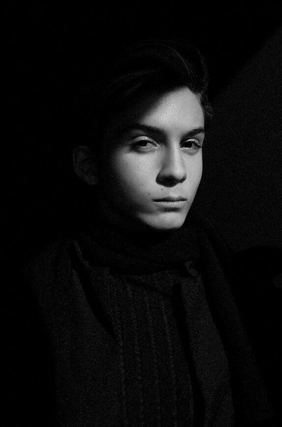 creative business portrait in black and white of a man looking into the camera