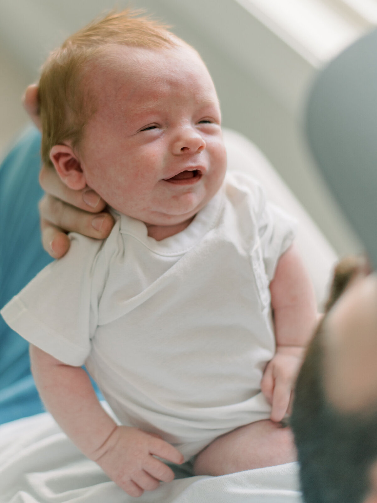 Dad holding newborn baby boy by Richmond VA photographer