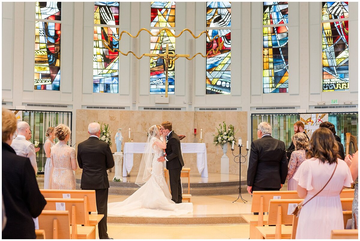 bride and groom at the altar at st michaels church biloxi