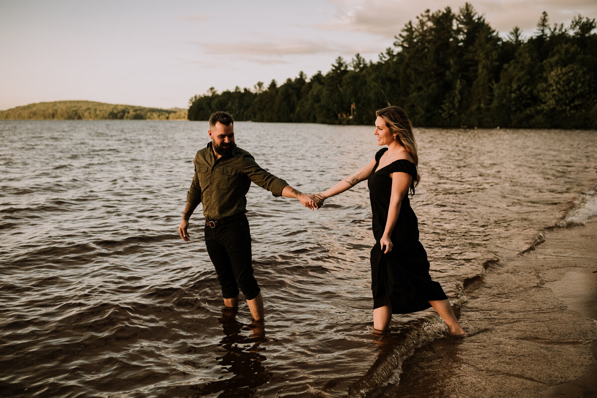 alana-andrew-engagement-cottage-beach-lake-sunset-dock-algonquin-16