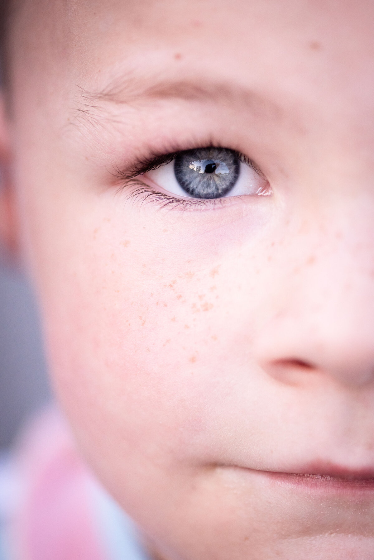 blue eyes close up detail photo of boy with freckles family photographer northeast indiana