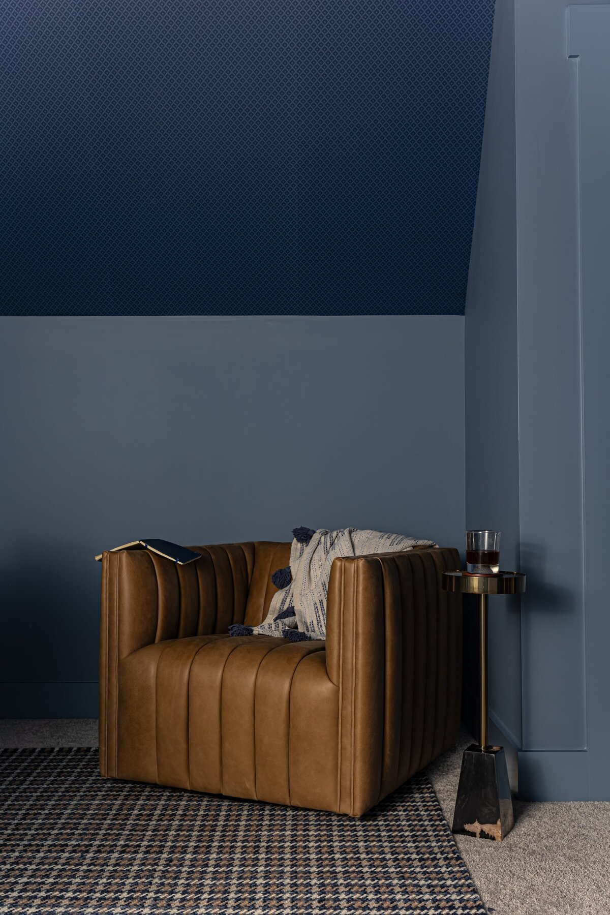 melinda chesson interiors everett place leather chair with blue walls and accent rug