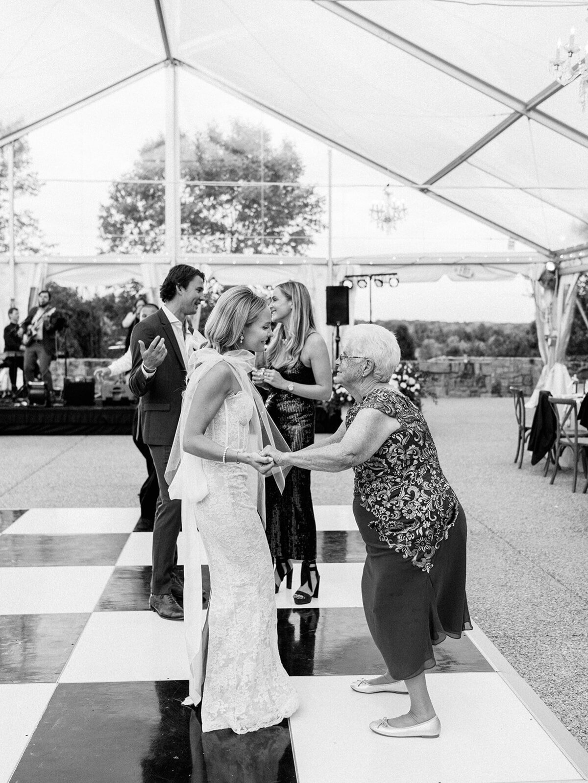 Bride and grandmother dancing on the dance floor
