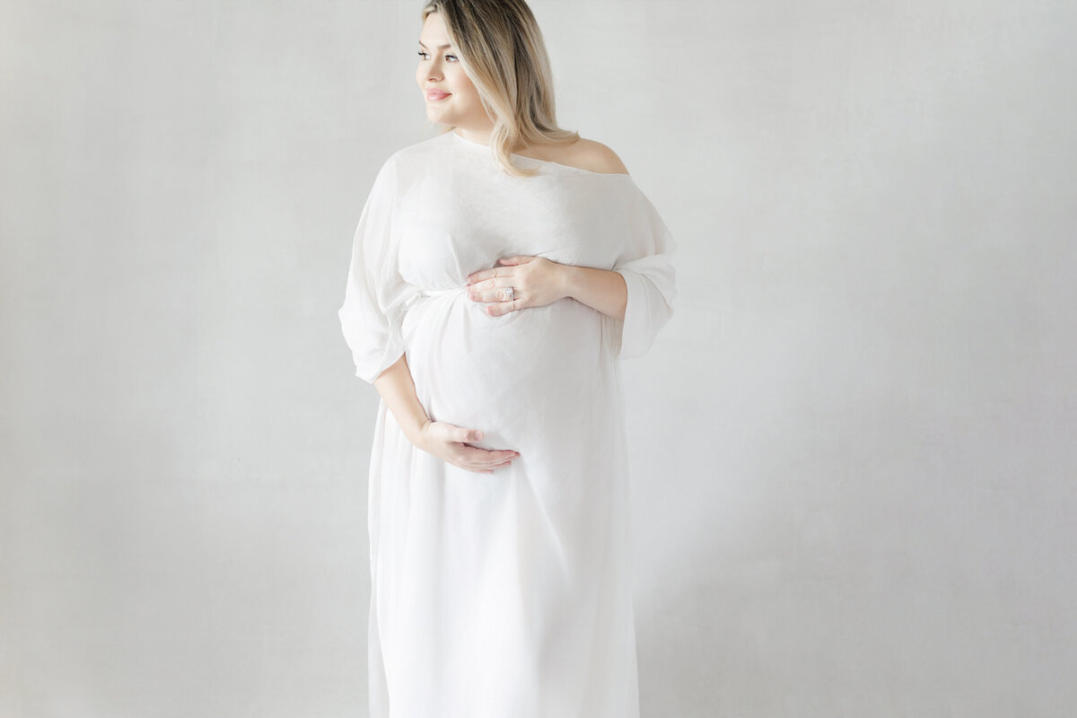 Tampa maternity session highlighting glowing mom-to-be Calli in neutral tones