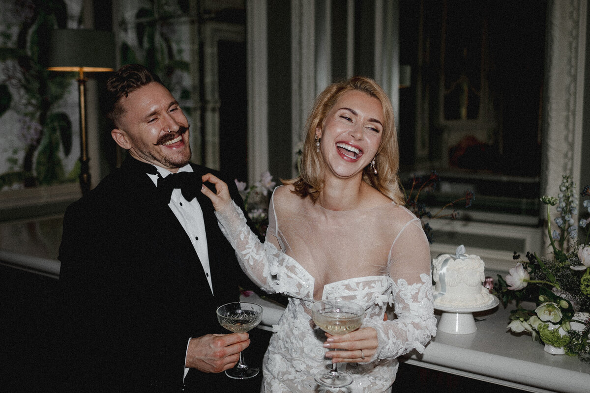 A wedding photographer captures the moment a bride and groom embrace during their first dance outside in the venue grounds.A wedding photographer captures the moment a bride and groom embrace during their first dance outside in the venue grounds.