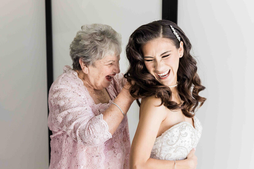 grandmother-helping-bride-dress