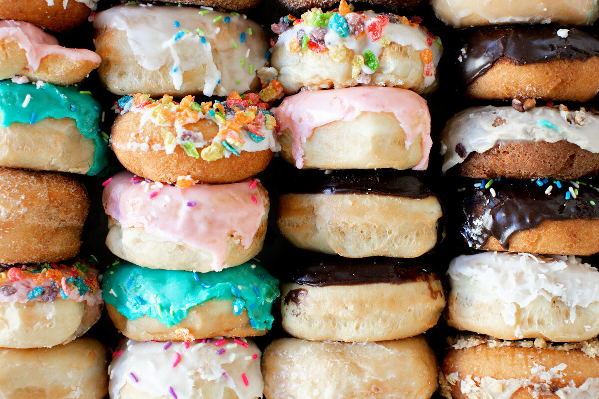 Close Up of Assorted Stacked Donuts - Daylight Donuts
