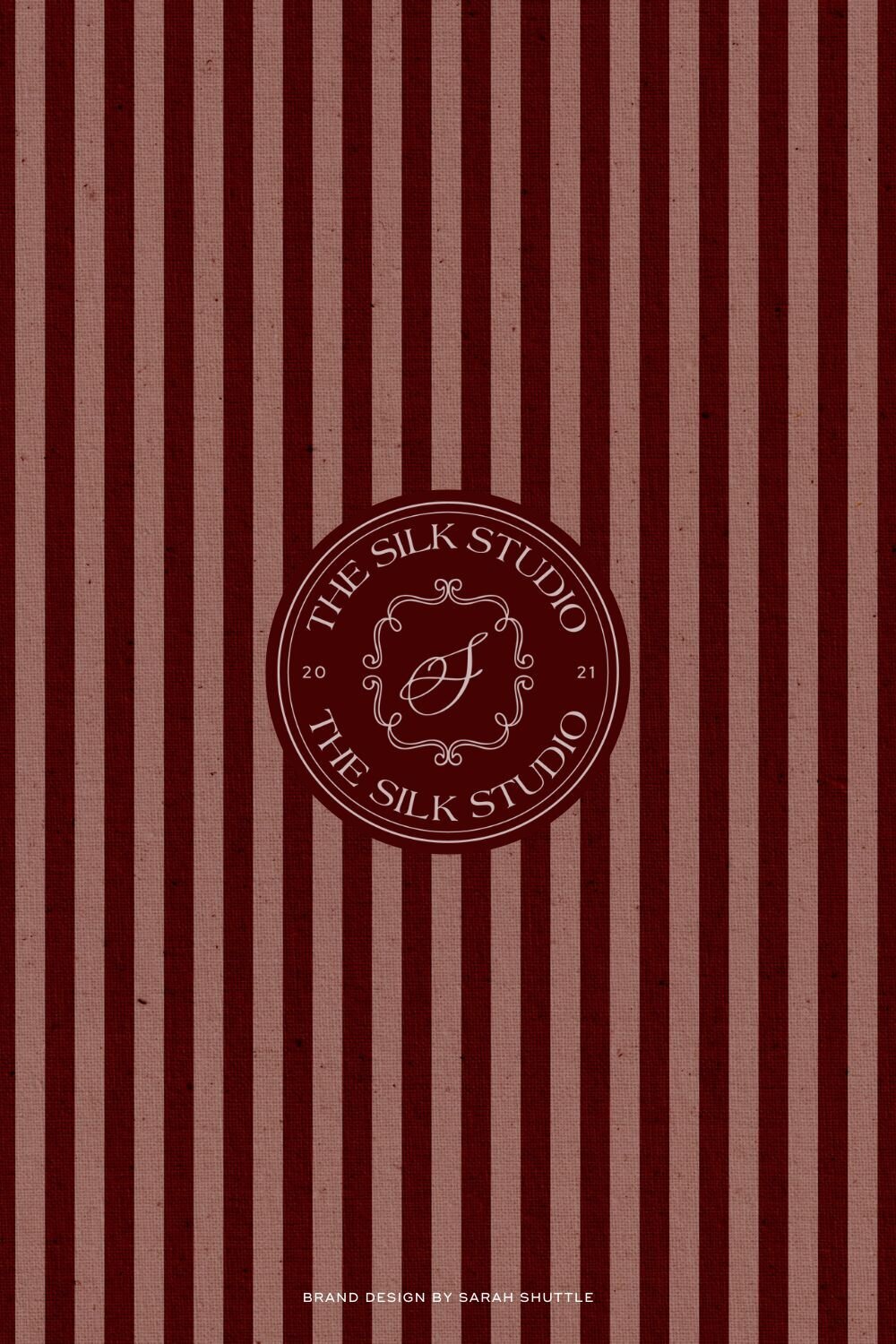 Circular logo design for The Silk Studio overlaid on bold red and pink stripe background