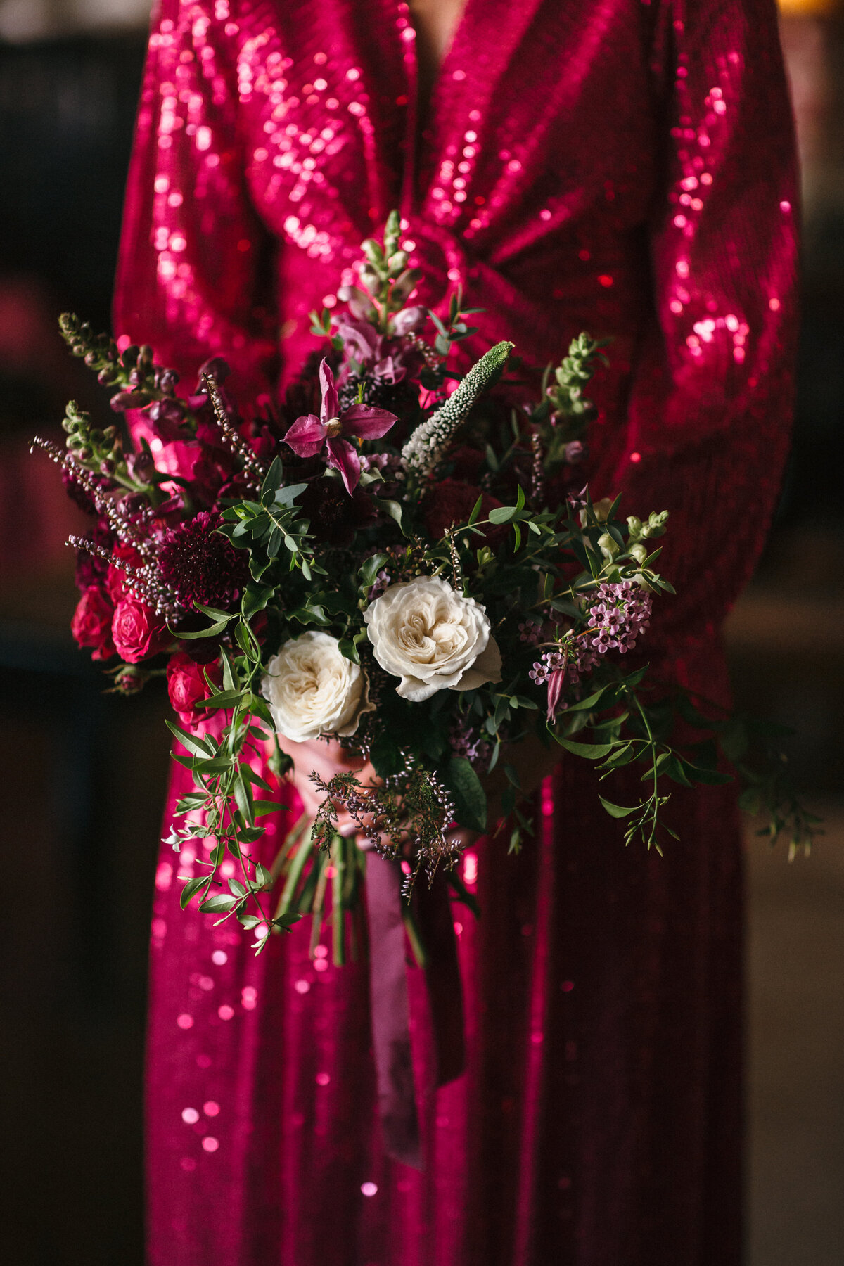 pink and white bouquet against sequined hot pink bridesmaid dress