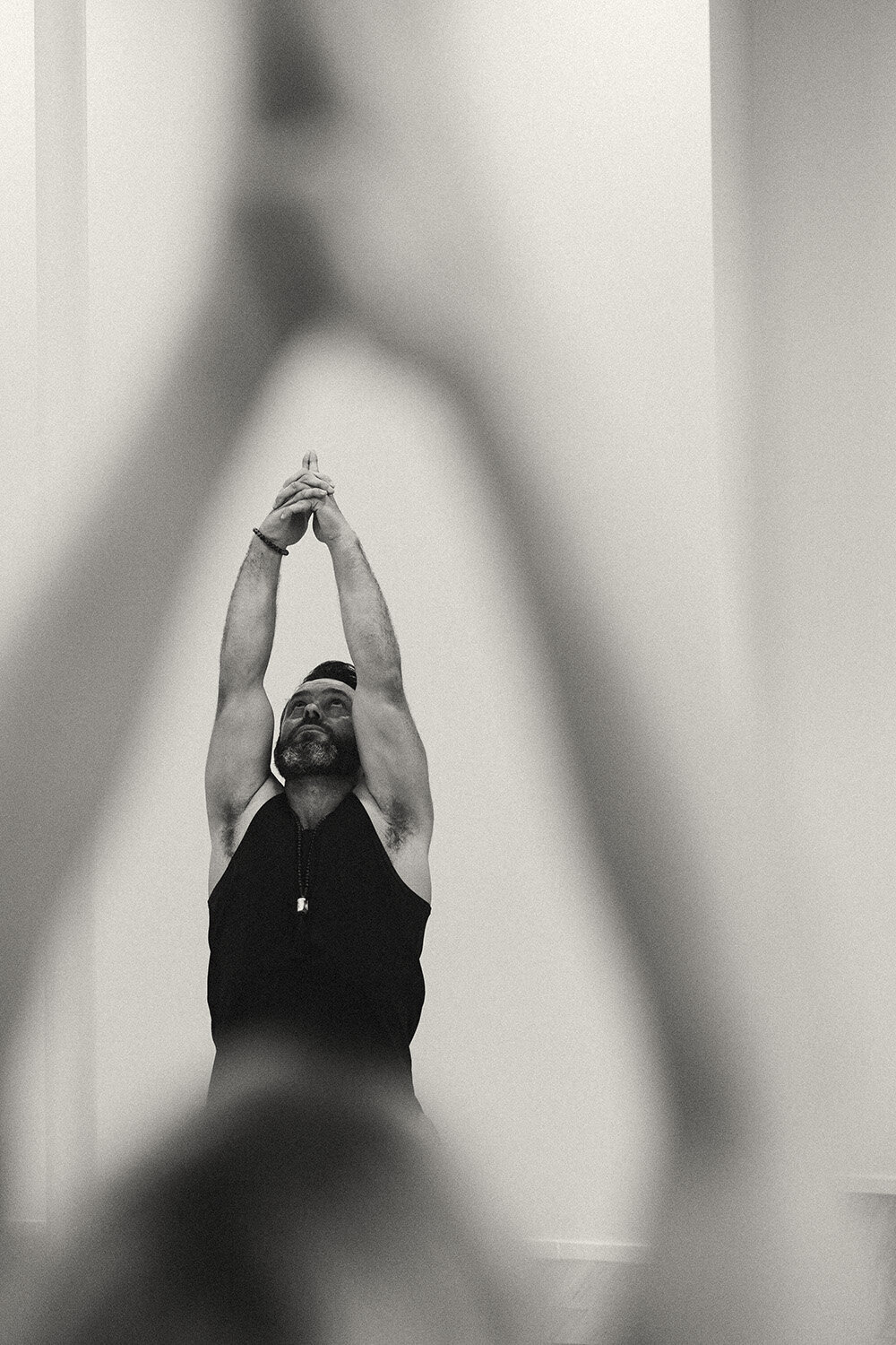 Sunshine Coast branding photographer captures a powerful stretch pose for a fitness-focused brand session.