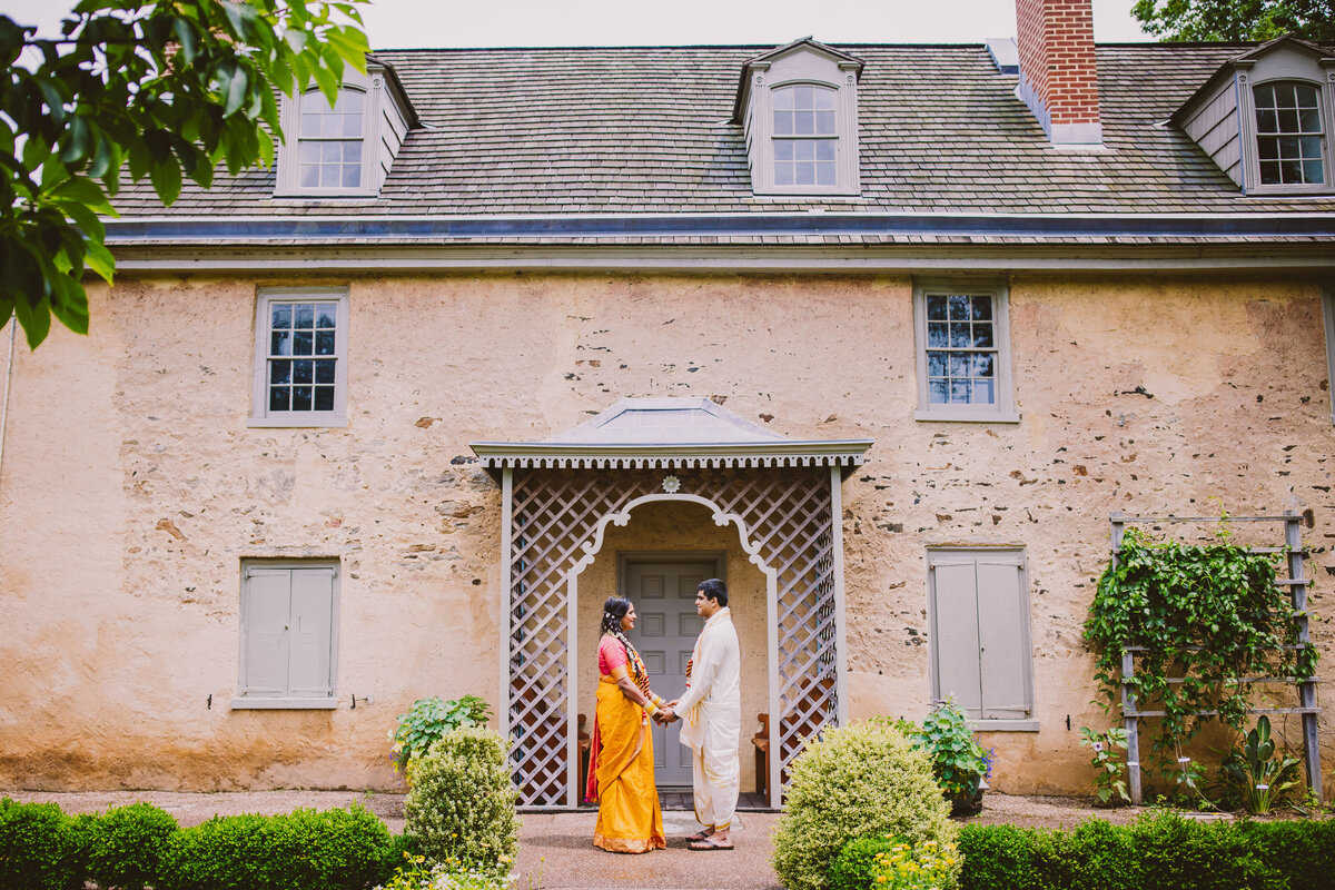 indian bride and groom share a moment after their telegu hindu ceremony at bartram's garden in philadelphia
