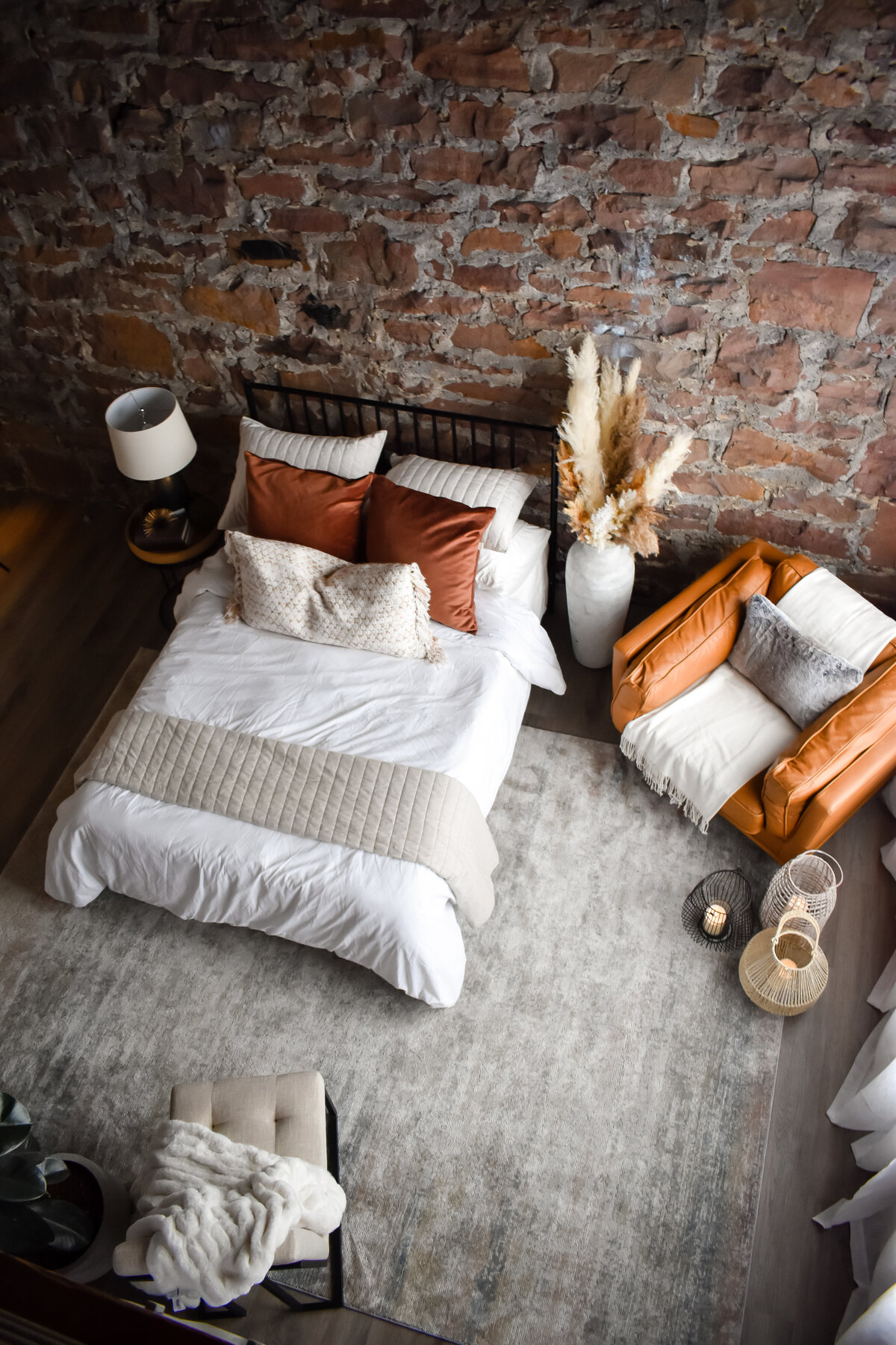 A cozy boho bedroom with two different chairs to sit on