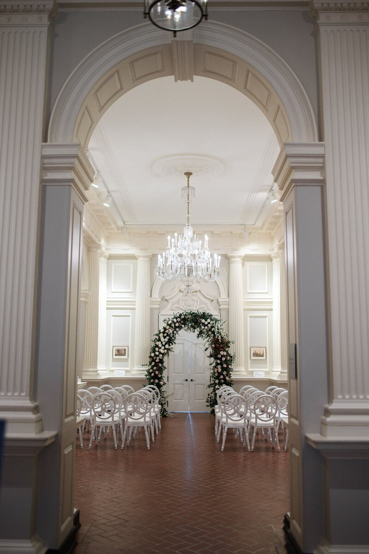 detroit michigan wedding photography of ceremony set up with chairs and floral arch