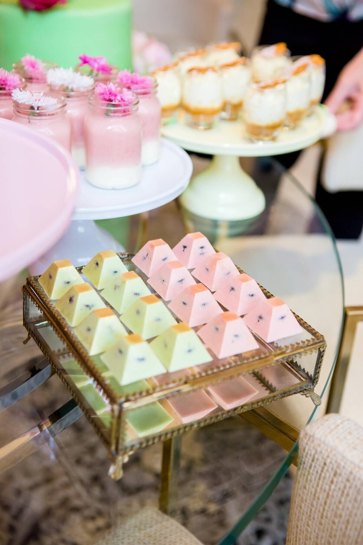 Chocotlate oreo pryamids on a glass box with dessert jars