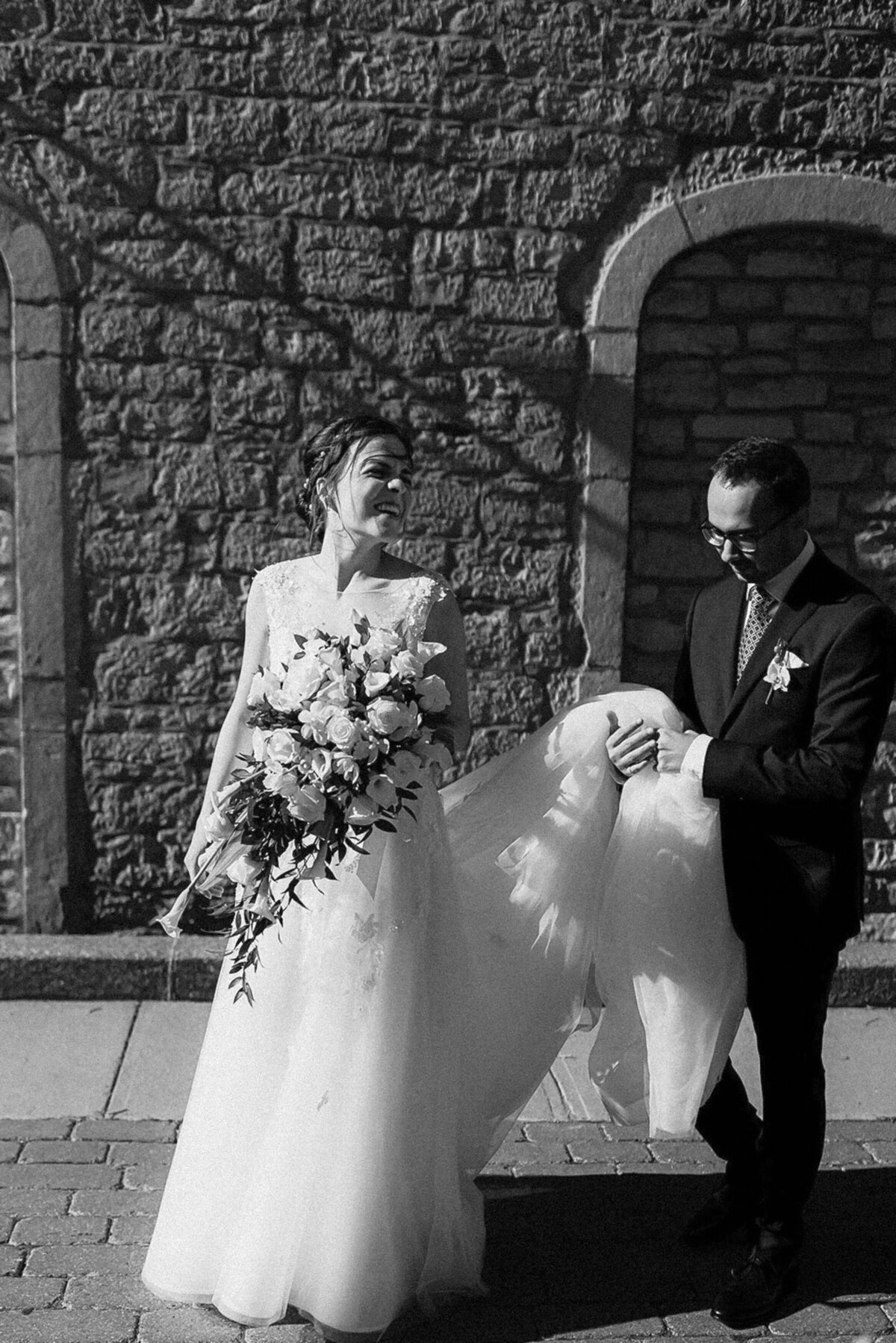 black and white portrait of a happy bride and groom in the streets