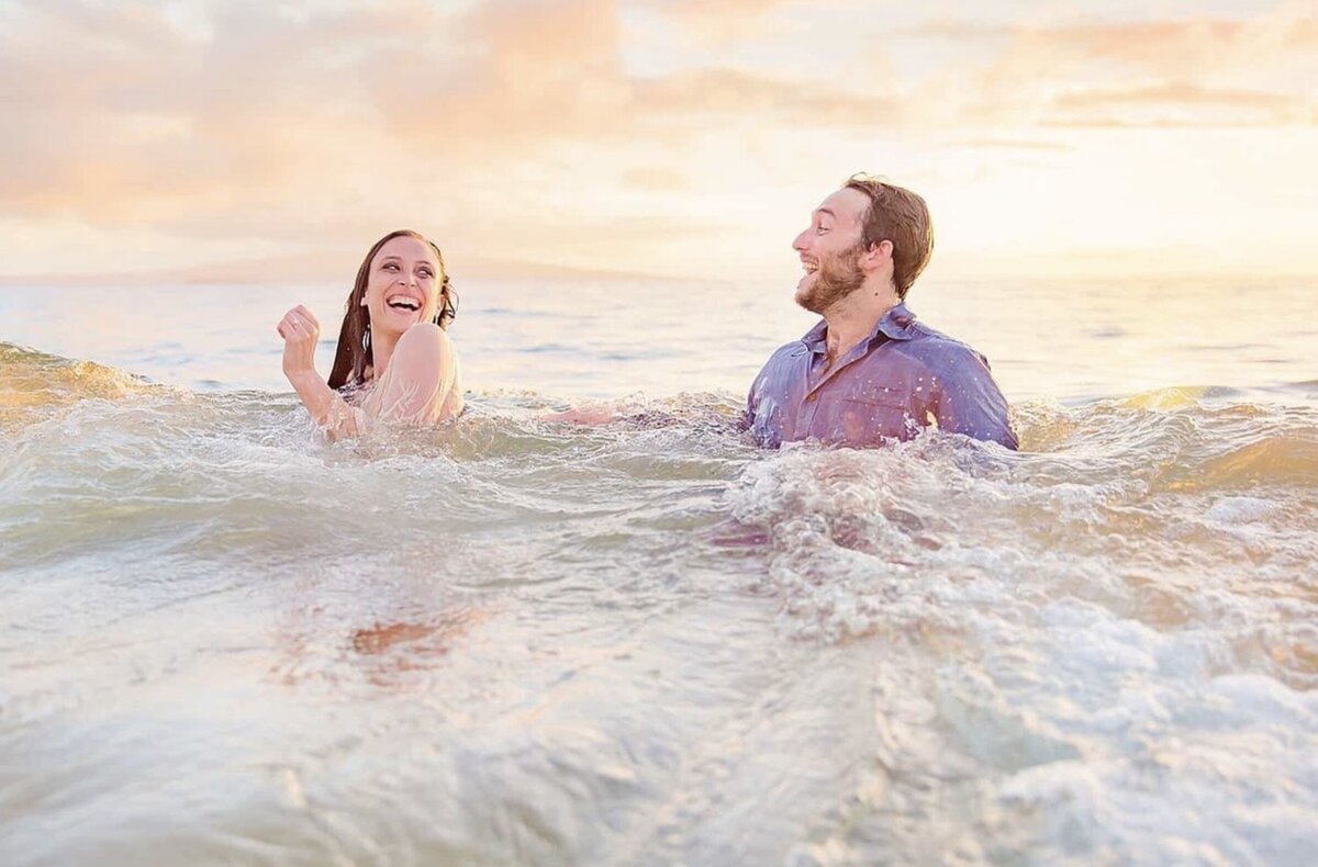 Couple gets wiped out in the waves during their proposal portraits in the ocean