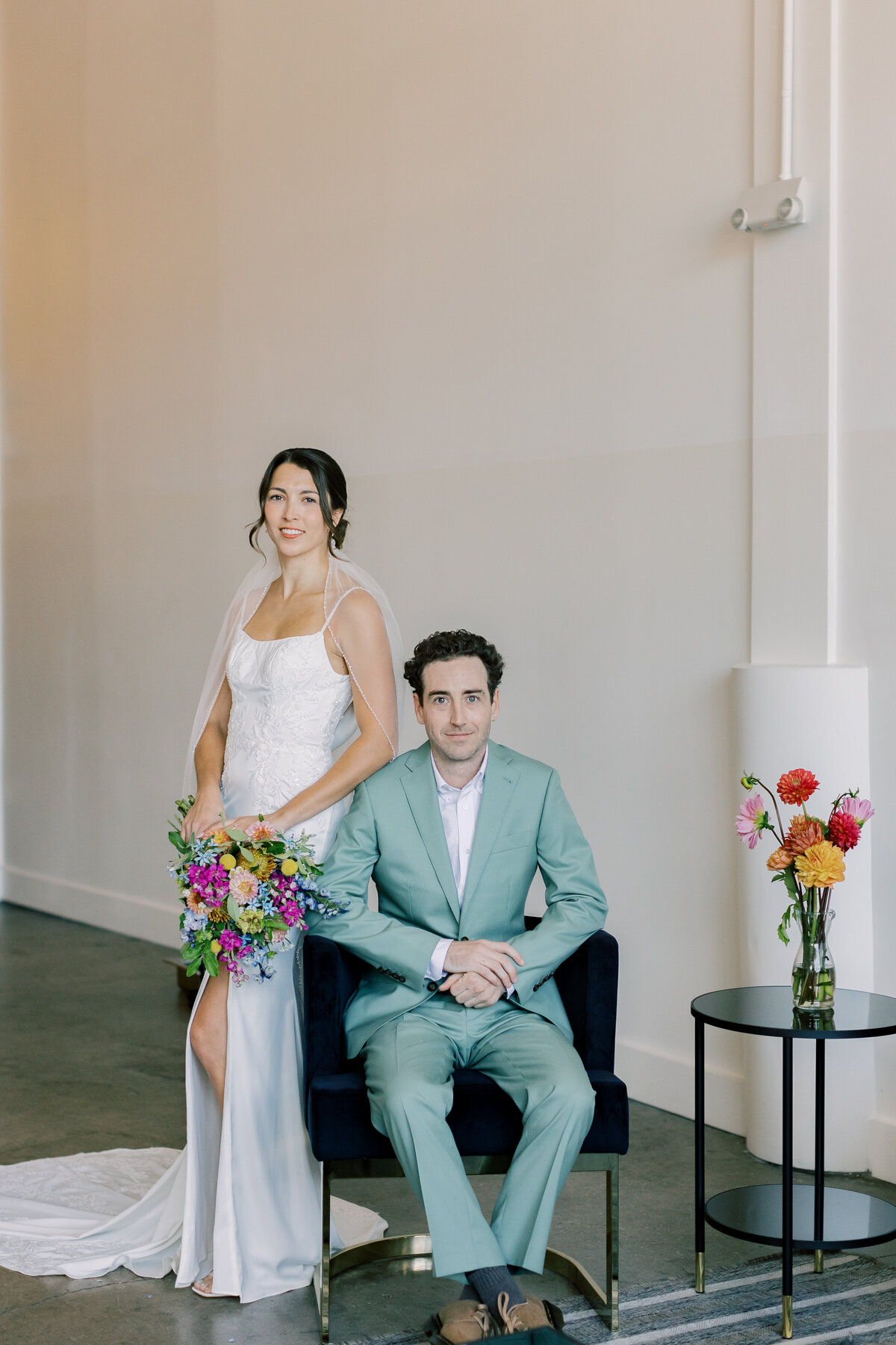 Brendan in sage Indochino suit seeing Sara in Bridal Chateau gown during first look at Fetewell wedding venue.