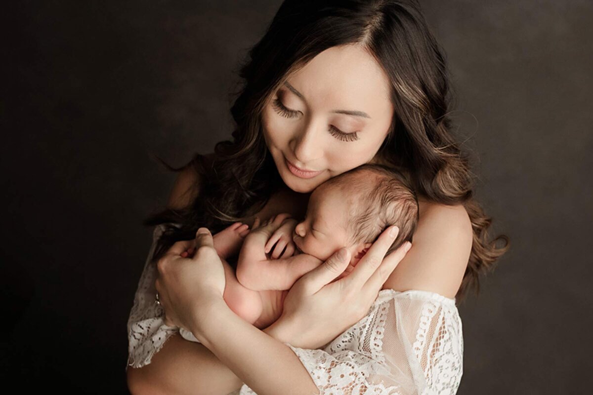 Newborn portrait of mother and child