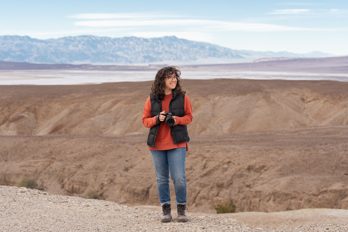 Stephanie Lamar with camera in death valley scenery