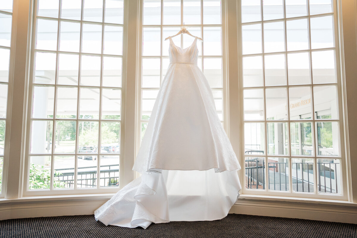 wedding dress hanging in the window at The Grand Resort in warren ohio