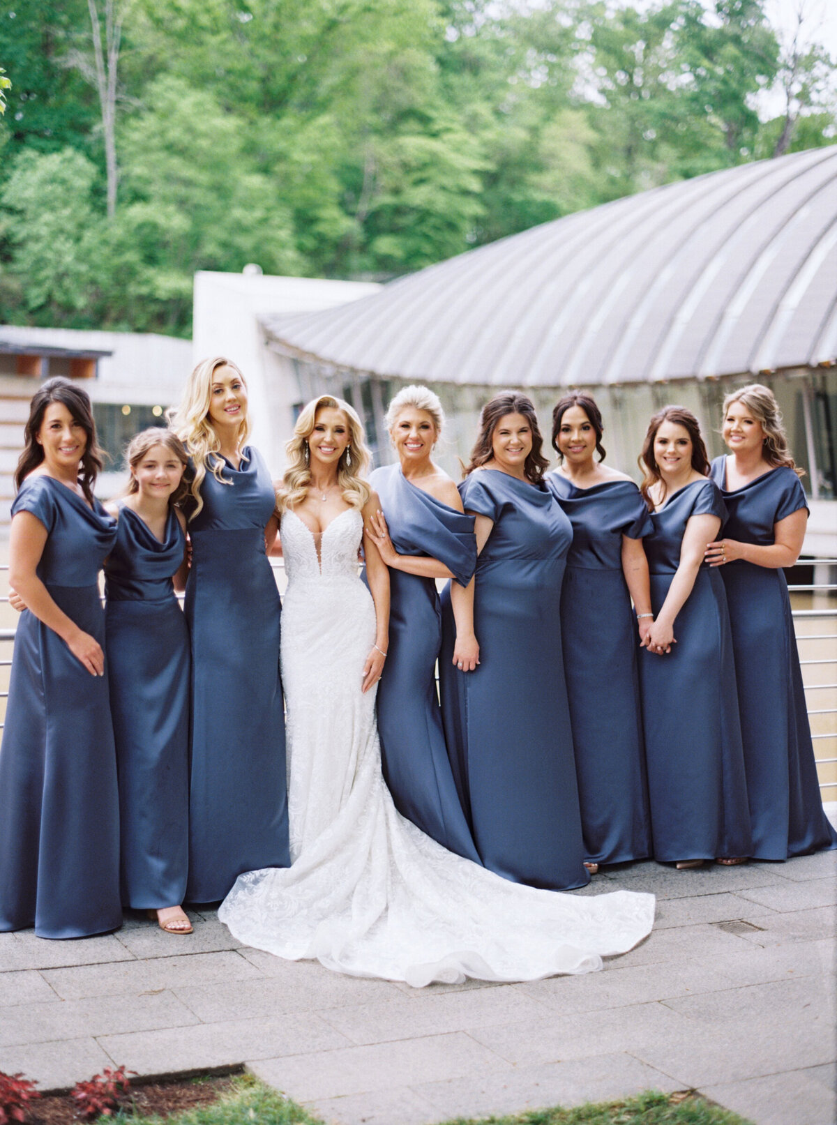 A wedding day photo of the bride and her bridesmaids at Crystal Bridges Museum of American Art in Arkansas