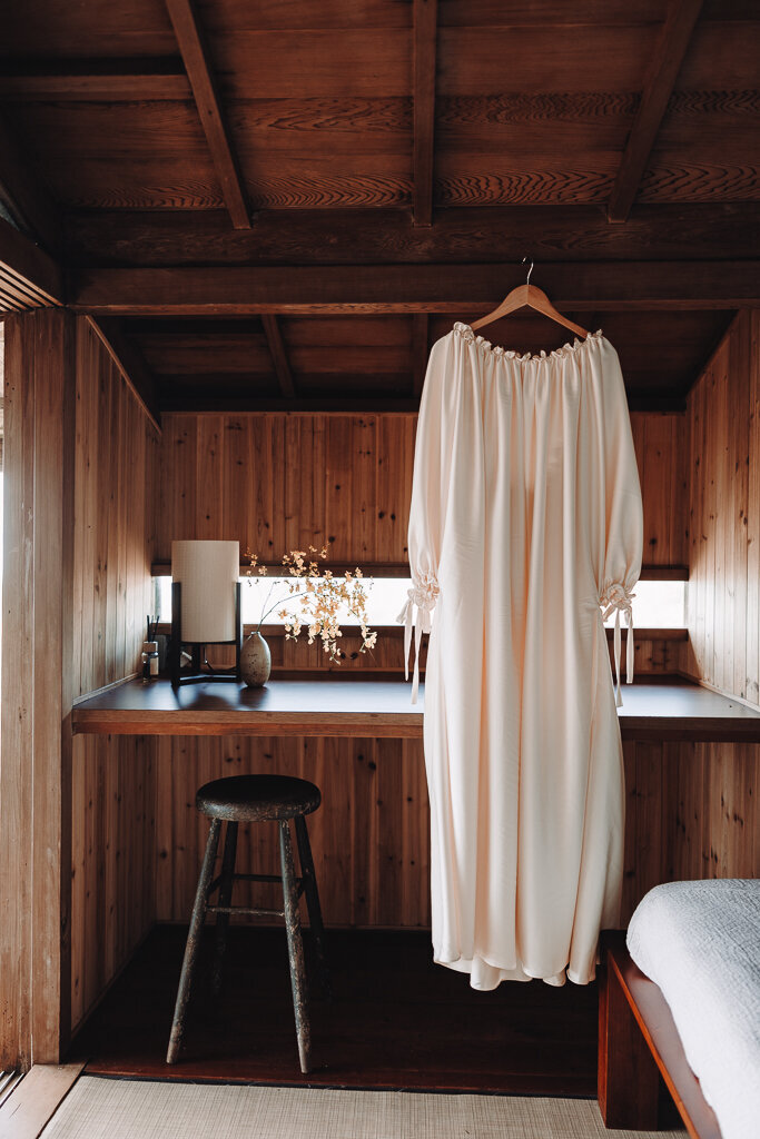 Elopement in Kapolei Hawaii dress hanging in cabin