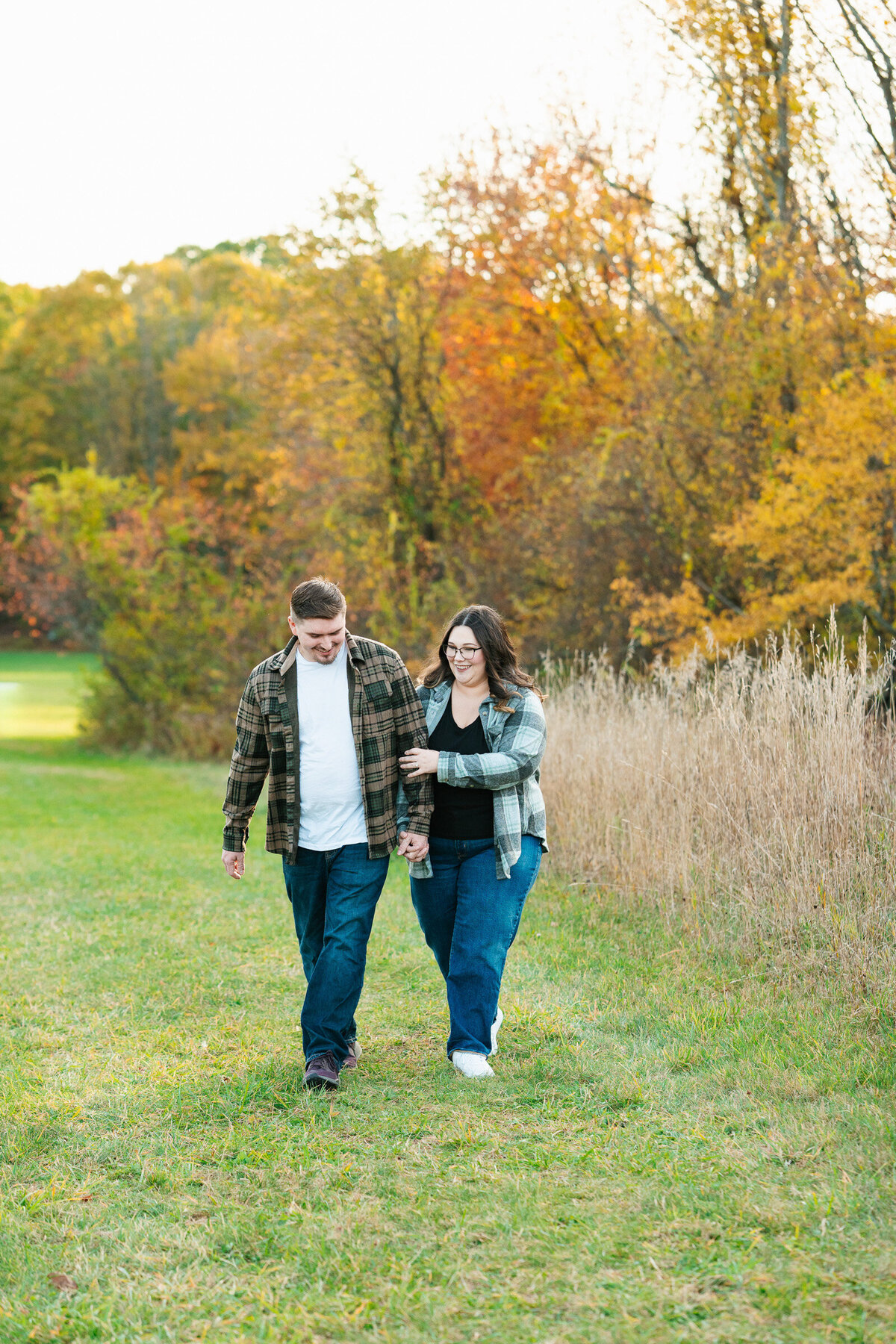 Candid New England fall engagement photography with emotional natural moments