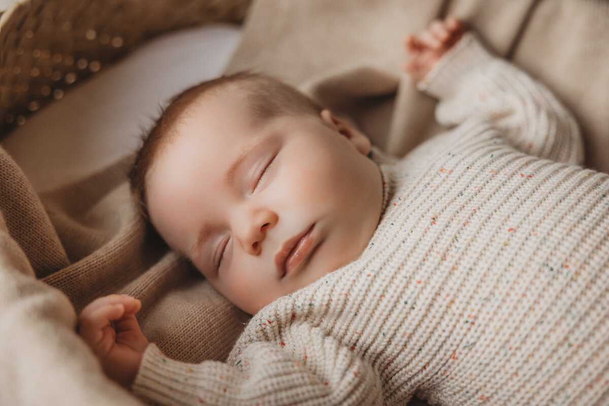 newborn baby posing during newborn photoshoot captured by Bie