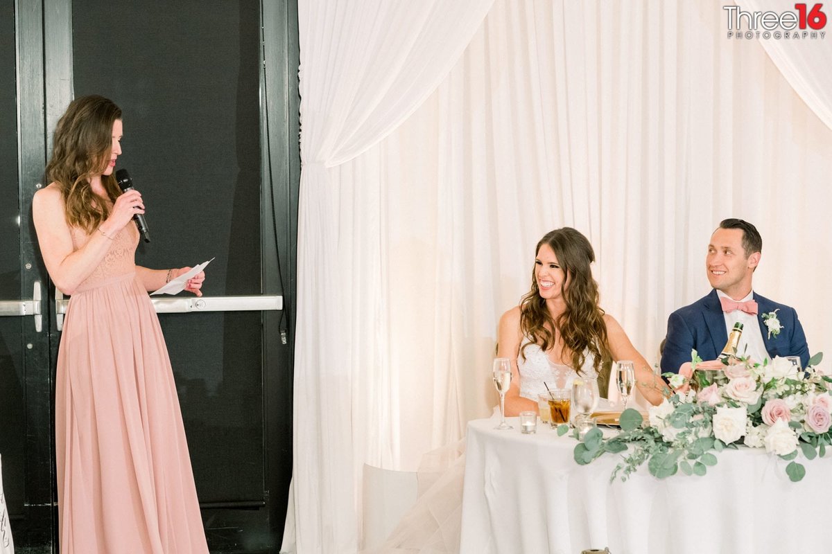 Maid of Honor toasts the newly married couple