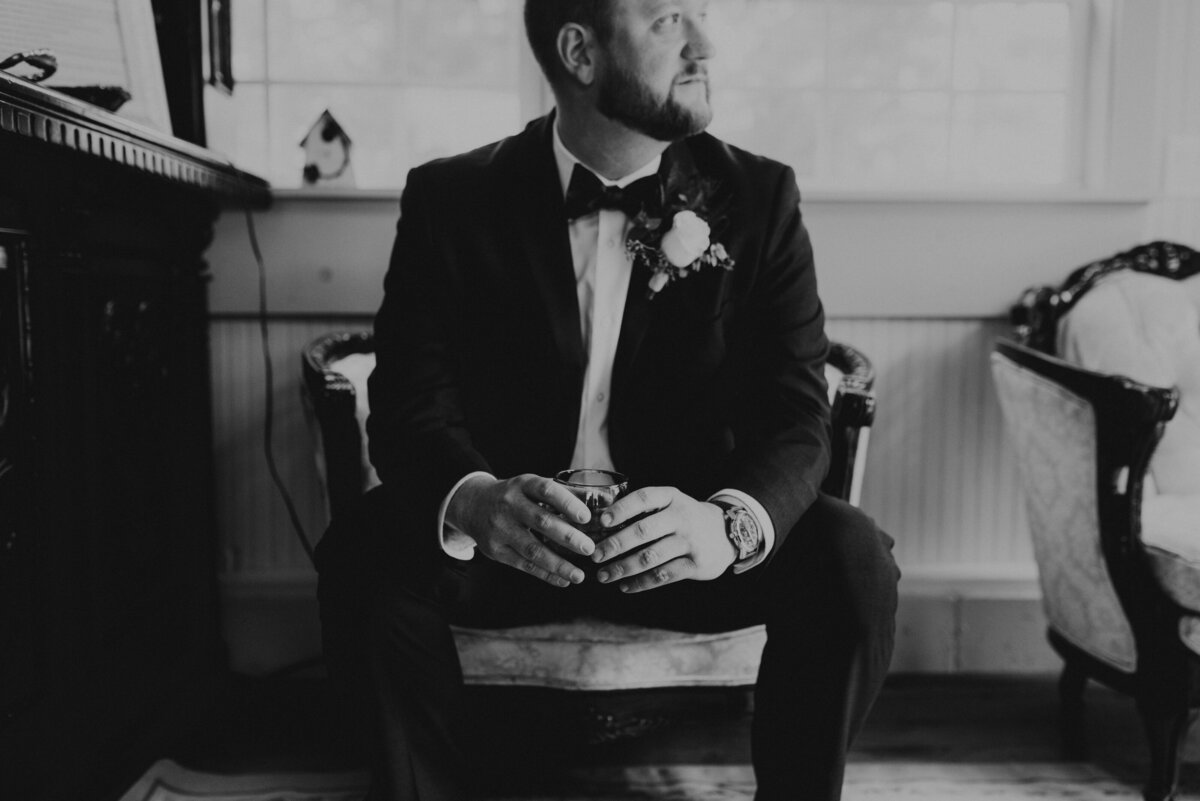 Groom holding a glass