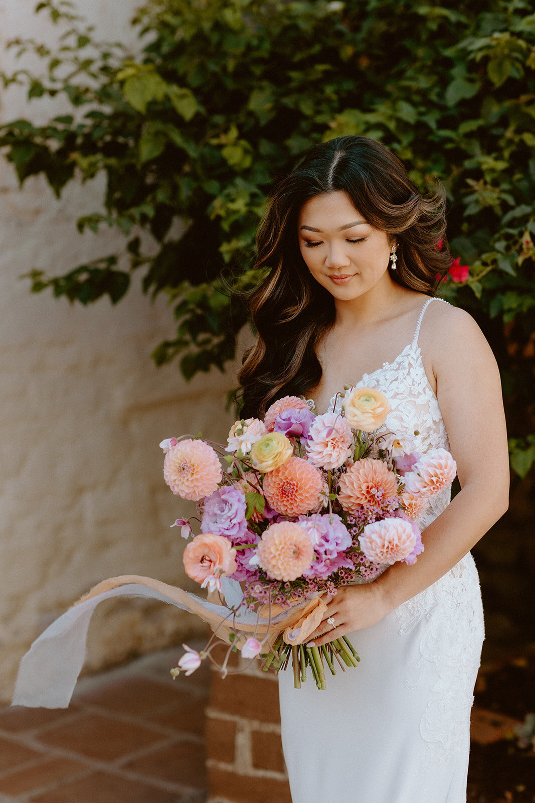 Bride holding a colorful bouquet