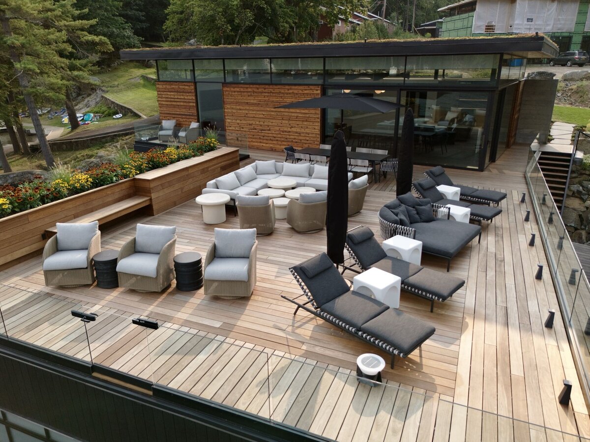 outside view of boat house with lounge deck and main home still under construction