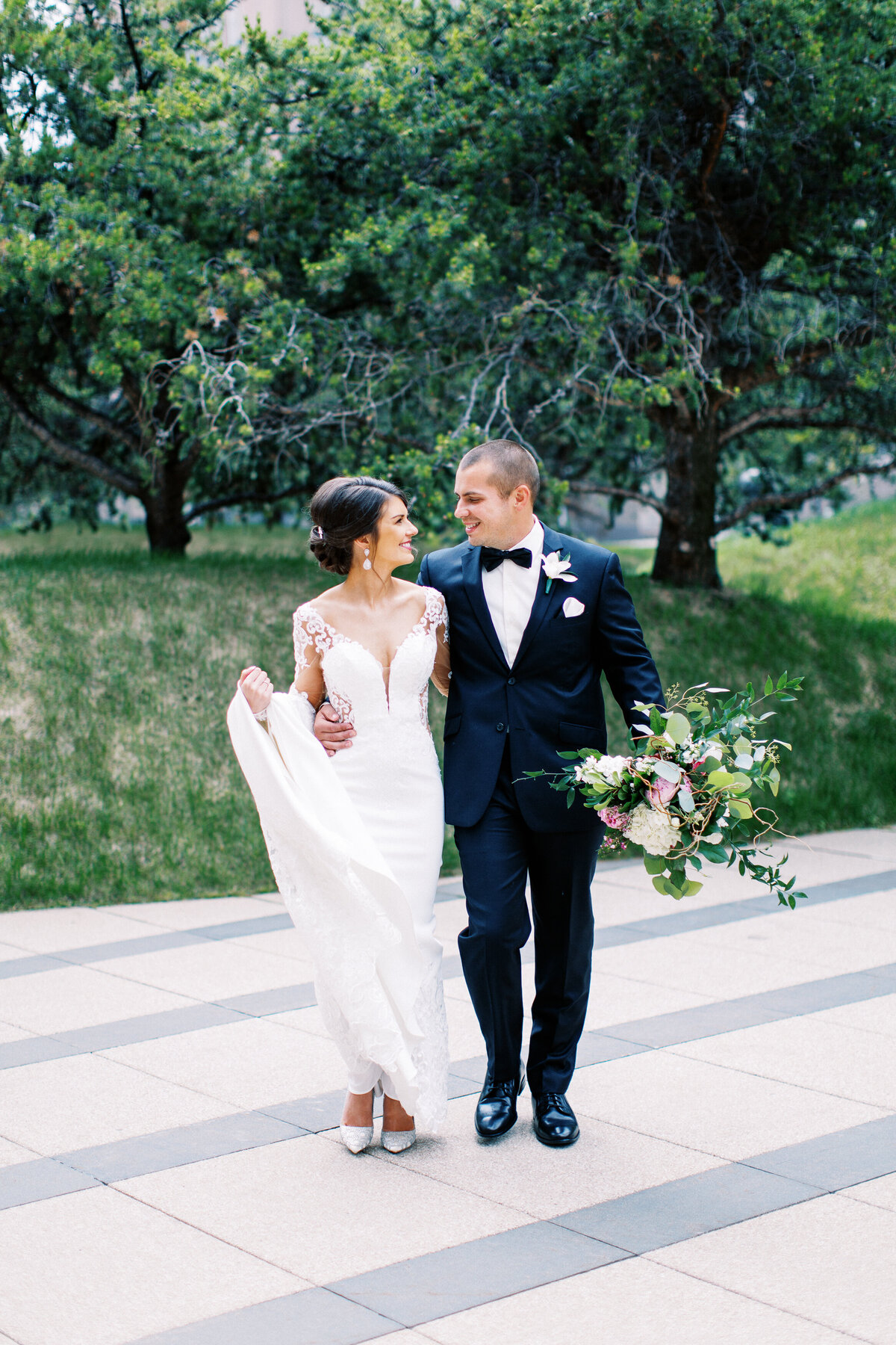 Newlyweds walking with the joy in Minneapolis streets