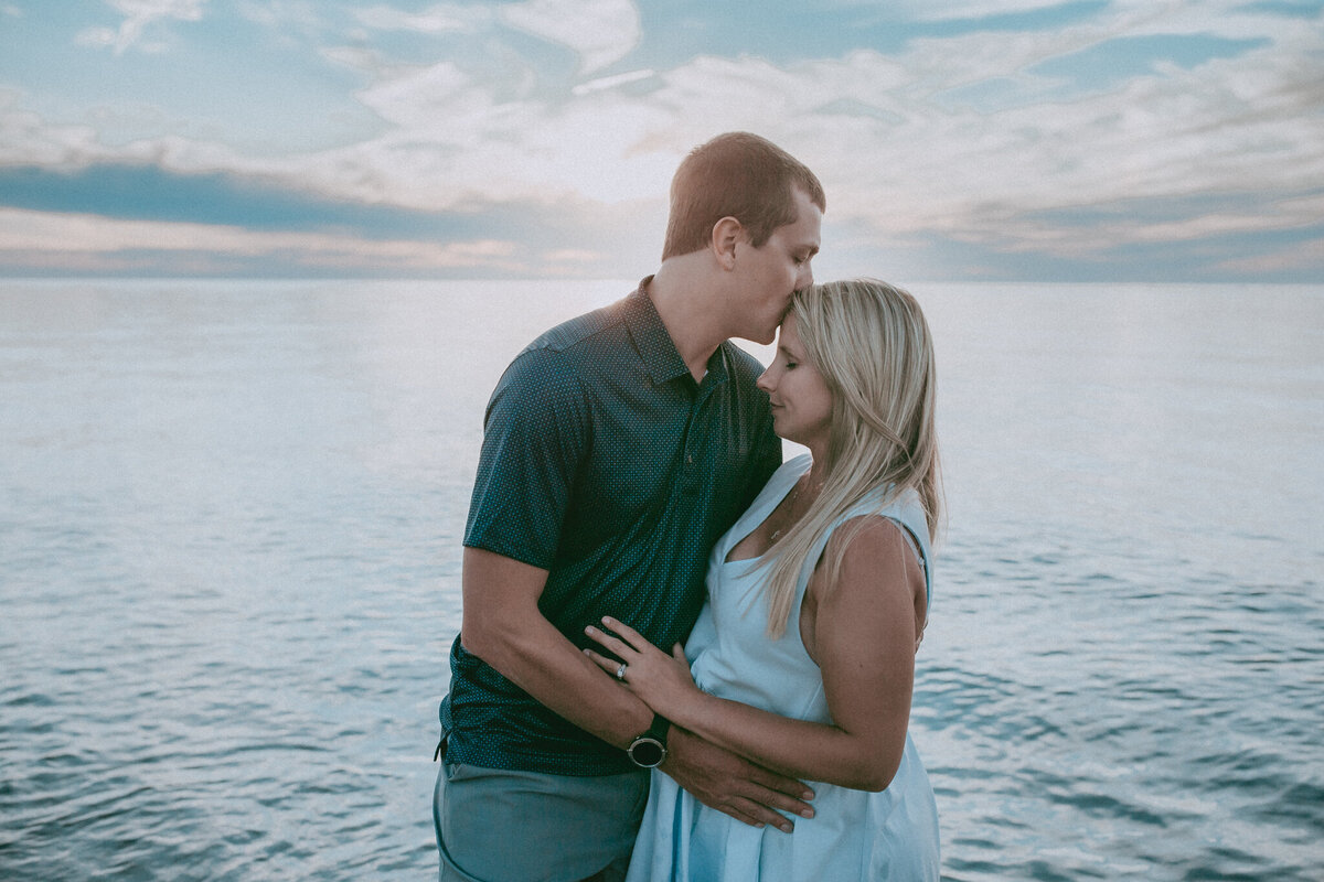 husband kissing wifes head