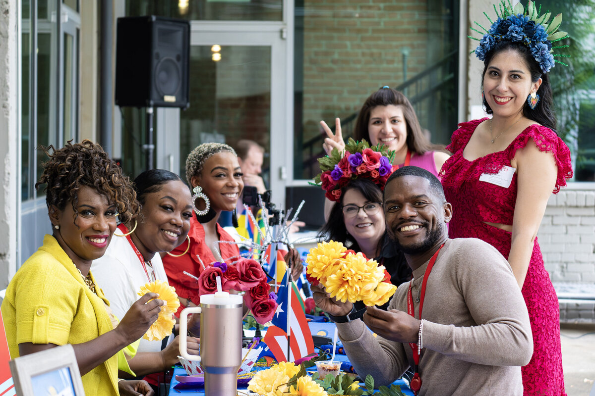 Tapestry of creativity as women showcase their unique artworks at Soleil Vida Studio's art workshop. Adorned in vibrant dresses and personalized flower crowns, their radiant smiles reflect the joy of self-expression and community in this empowering artistic journey.