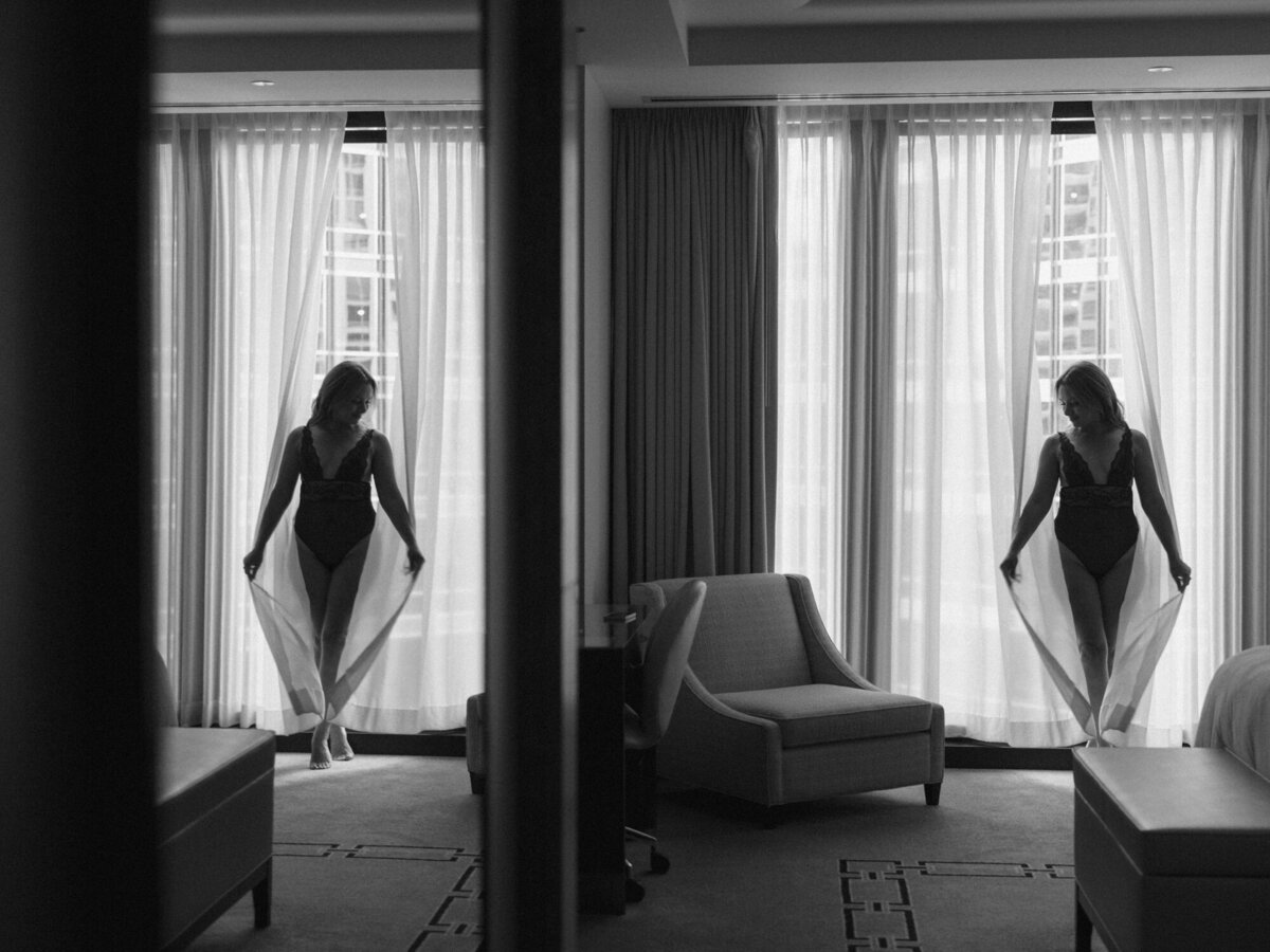 A black and white mirror reflection boudoir photo taken in Chicago