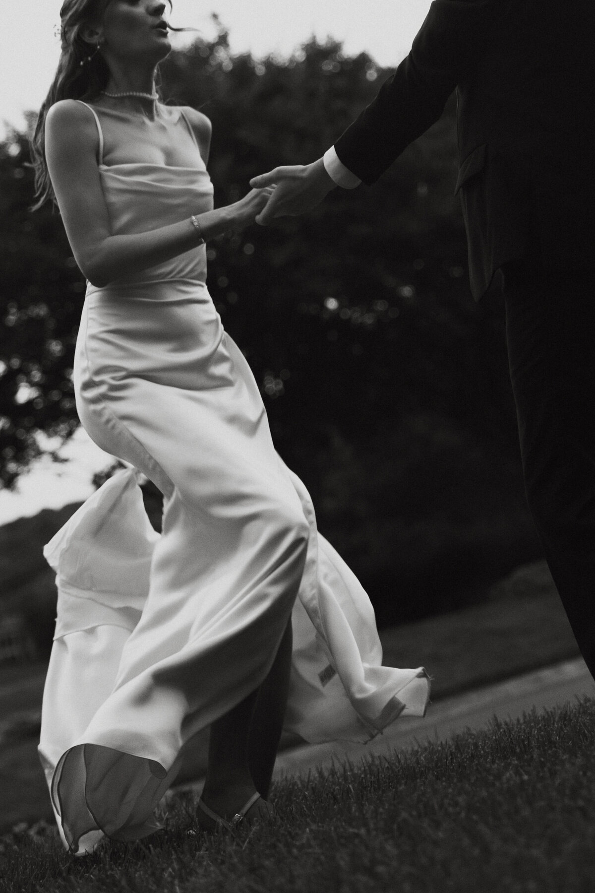 black and white photo of couple dancing on wedding day
