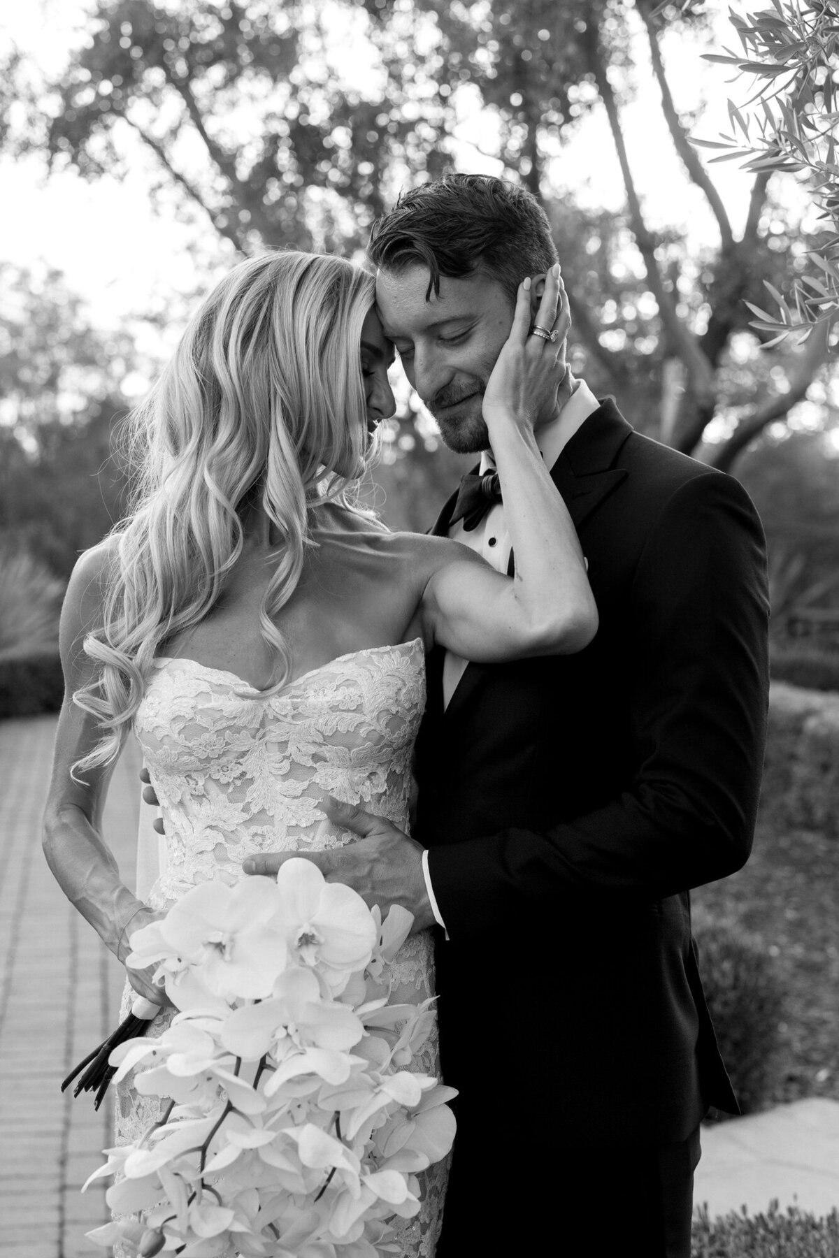 Bride and groom embracing each other during portraits at El Chorro wedding venue in Paradise Valley, Arizona